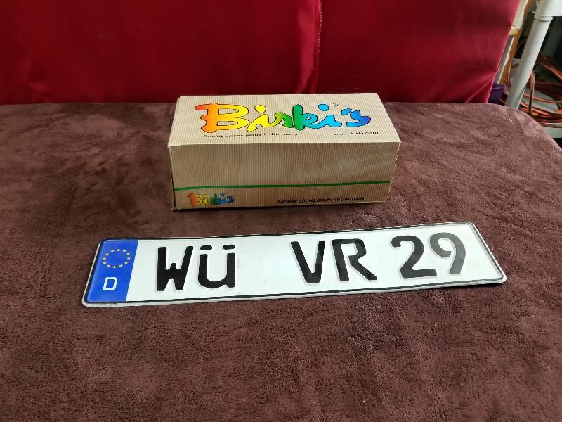 lot 7851 image: European License Plate and Shoes Lot