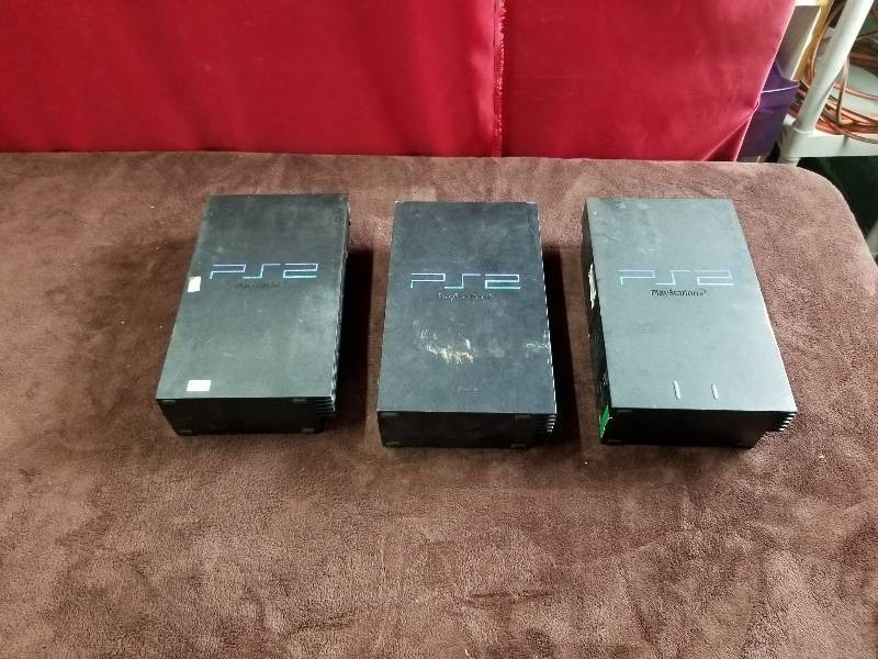 lot 7885 image: three Playstation2 Consoles