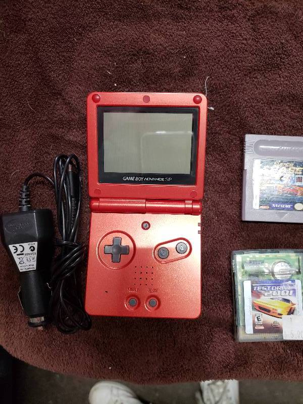 lot 7908 image: Gameboy Advance SP with Games