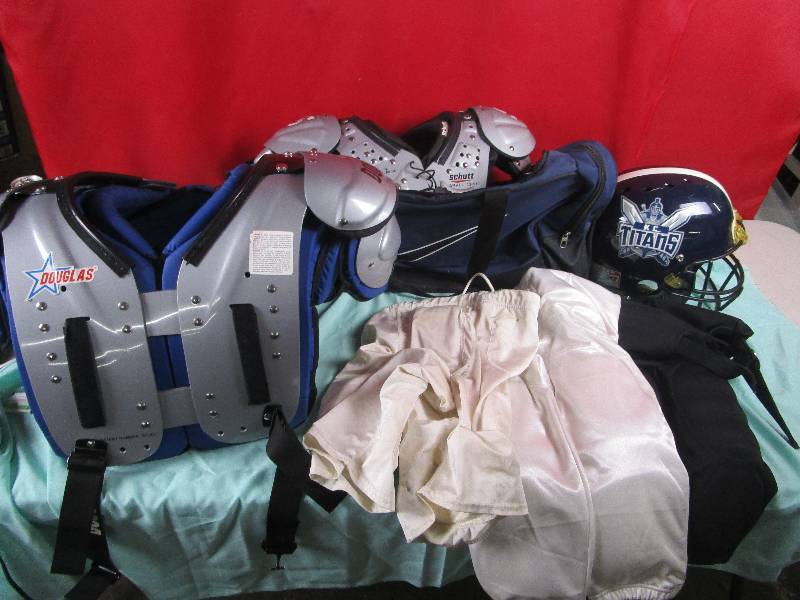 lot 7130 image: Youth Football Padding, Pants, and Nike Bag