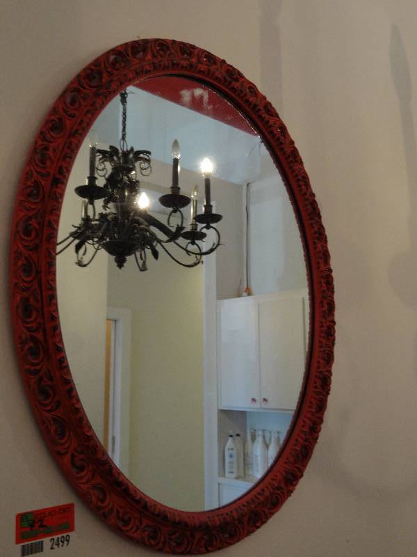 lot 2499 image: Oval Pink Mirror with Black Finish On edges