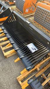 lot 114 image: Unused 84-inch Landhonor Skid Steer Rock Bucket RB-14-84W