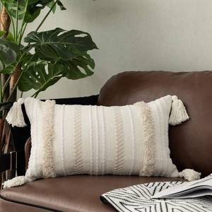 lot 2413 image: OJIA Lumbar Decorative Boho Throw Pillow Cover, 12 x 20 Farmhouse Cute Pillowcase Minimalist Neutral Collection Cream White Tufted with Tassels Woven Cushion Cover for Sofa Couch Bedroom Living Room