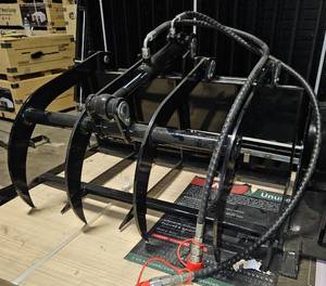 lot 4265 image: Unused 2025 Industrial-Grade Hydraulic Grab WoodHay Fork Attachment Designed for Mini Skid Steer Loaders - 360 Degree Rotation for Precise Log Positioning - Hardened Steel Tines Penetrate Wood Piles - Dual Cylinders