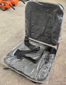 lot 4175 image: Unused Universal Equipment Seat with Safety Belt designed for a wide range of construction and agricultural equipment. Features integrated safety seat belt, pre-drilled mounting points, and durable metal frame construction