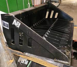 lot 4268 image: Unused 2025 IRLRB Industrial-Grade Rock Bucket Attachment Designed for Mini Skid Steer Loaders