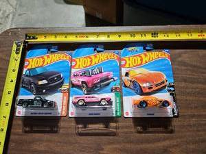lot 38 image: Hot Wheels Collection - Ford F-150, Reverse Race, and Stockar