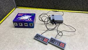 lot 102 image: 621 Classic Games Mini Console with 2 Controllers and Box - Works Great - Crazy what you can play