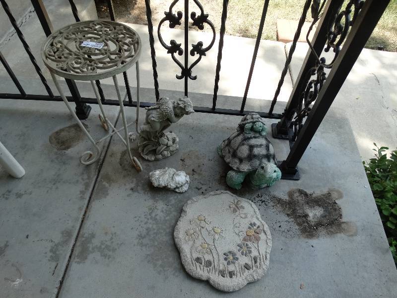 lot 8020 image: Yard decor and small table.