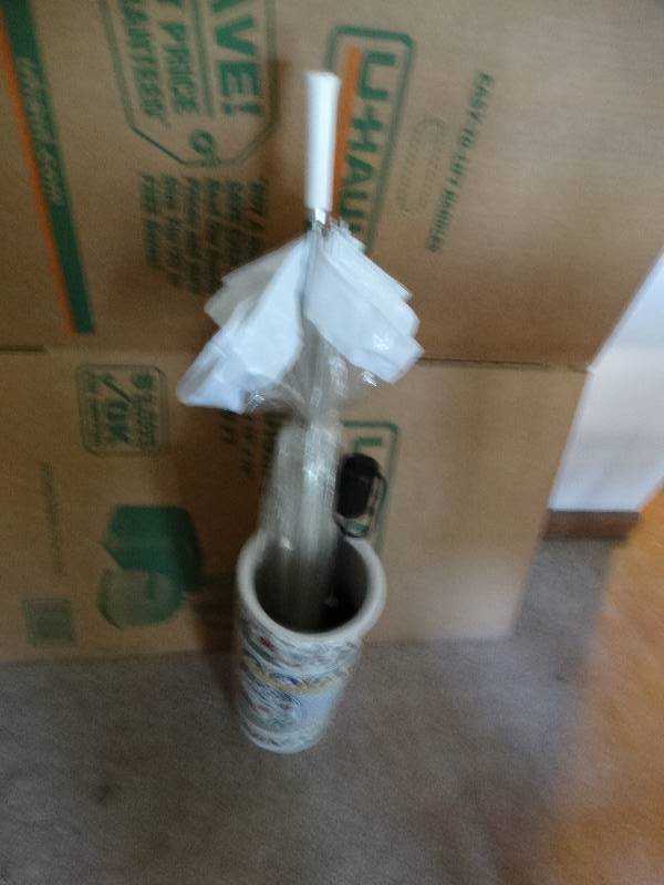 lot 8038 image: Glass umbrella holder with 2 umbrellas