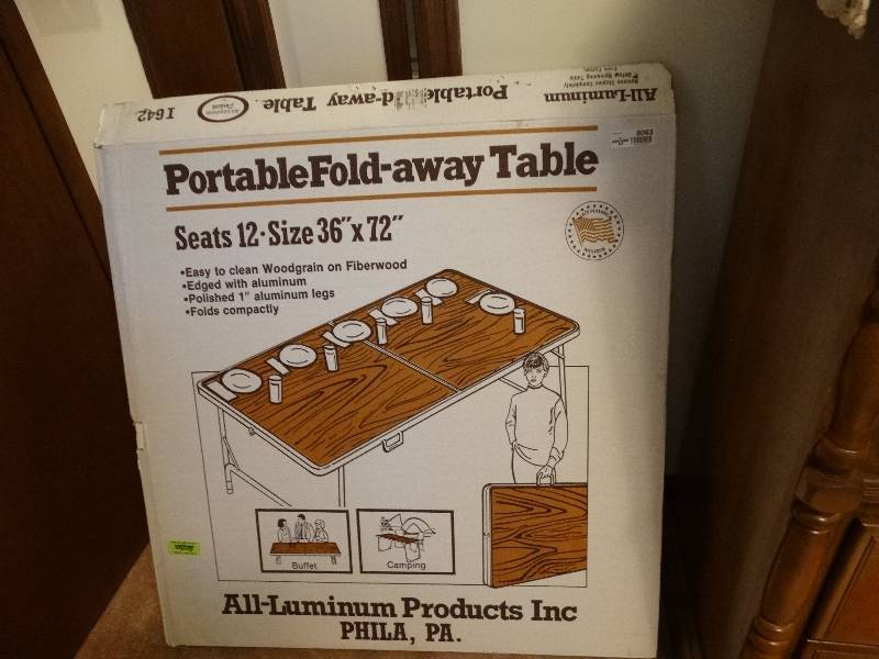 lot 8063 image: Portable fold- away table.