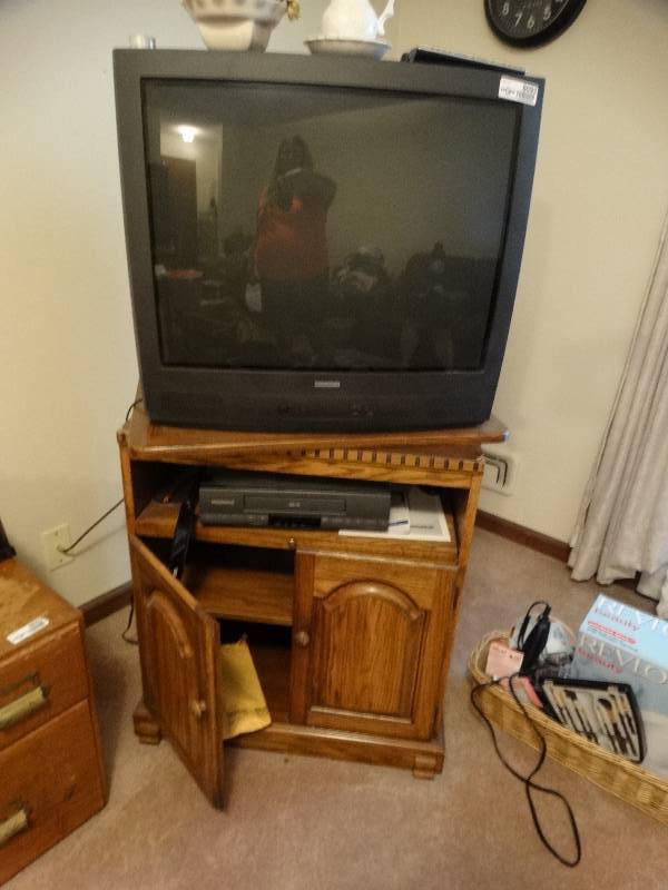 lot 8093 image: Tv stand, tv, magnavox vhs player.