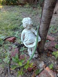 lot 250 image: 22 Girl bird feeder garden statue.