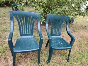 lot 268 image: (2) Plastic outdoor green chairs.