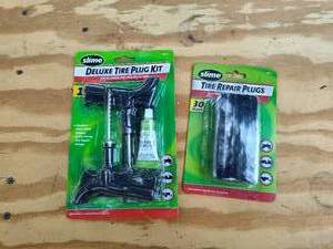 lot 299 image: Deluxe tire plug kit.