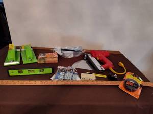 lot 365 image: Assorted Hardware, Level, Arrow Electric Stapler, and more.