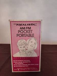 lot 375 image: AMFM Pocket Portable Radio.