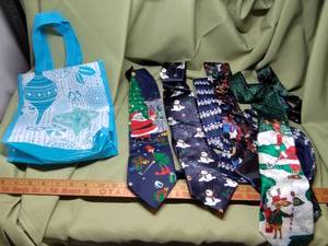 lot 695 image: Christmas Ties and Bag.