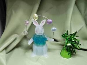 lot 701 image: Easter Bunny Figurine and Paperweight.