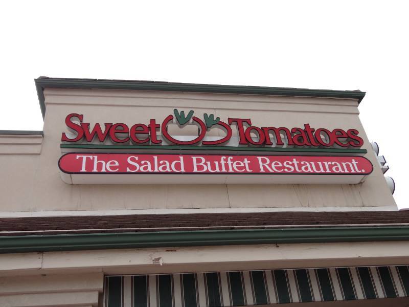 lot 4303 image: Sweet Tomatoes Sign Approx. 20FT Long