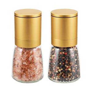 lot 16280 image: Vucchini Gold Salt and Pepper Grinder Mill - Adjustable Coarseness Ceramic Brass Spice Grinder Shaker - Refillable Glass Pepper Grinders for Home Golden Kitchen Accessories - Retail $17