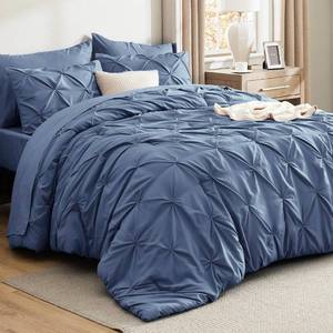lot 1032 image: Bedsure King Size Comforter Set Slate Blue - Bed in a Bag King Size 7 Pieces, GentleSoft Pintuck Bed Set Gift for Family, Pinch Pleat Slate Blue Comforter with Sheets, Pillowcases and Shams - Retail $60