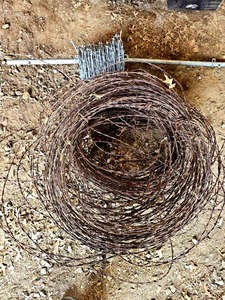 lot 56465 image: Industrial Barbed Wire Rolls with Metal Post and roll of galvanized fencing