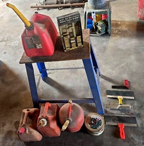 lot 56529 image: VintageAntique Buss Fuses, trowels, set of gas cans and bench grinder stand