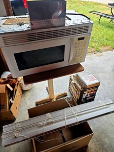 lot 56554 image: Mixed Lot - Hotpoint Microwave, Auto Repair Manuals, Square Table & Mini Blinds