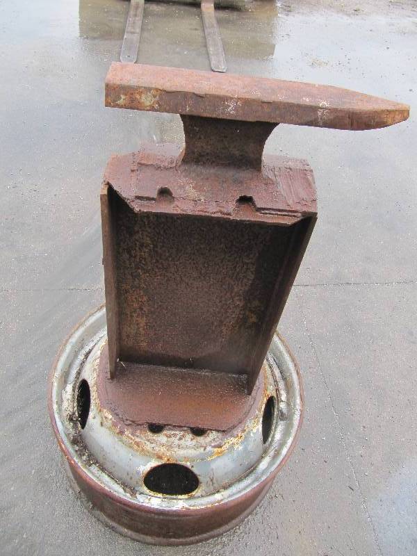 lot 2136 image: Heavy Duty Anvil Welded to a Truck Wheel (Shop Tools)