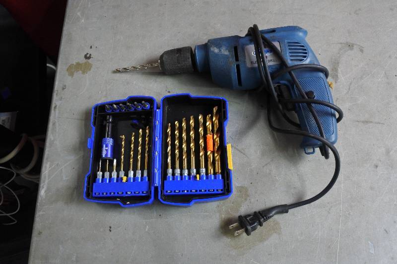 lot 10458 image: Cummins Electrical Drill with Drill Bits