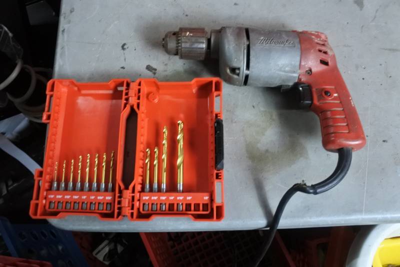 lot 10528 image: Corded Drill with Milwaukee drill bit box with bits