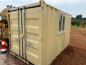 lot 1016 image: Unused 10 Foot Container with Window and Walk Through Door