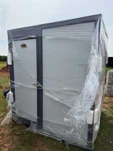 lot 1177 image: Unused 2025 IRMT Mobile Shower with Toilet - slight damage on front of unit and toilet lid broken in transport