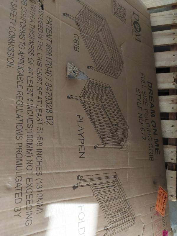 lot 20051 image: Dream On Me Full Size Folding Crib