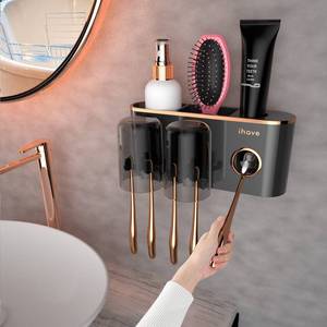 lot 1379 image: iHave Toothbrush Holders Bathroom Accessories with Toothpaste Dispenser, 2 Cups Toothbrush Holder Wall Mounted Bathroom Decor - Retail $17