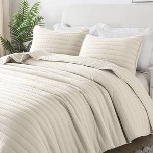 lot 1405 image: ROARINGWILD Ivory Oversized California Cal King Size Quilt Bedding Sets with 2 Pillow Shams, Lightweight Bedspread Coverlet, Quilted Blanket Thin Comforter Bed Cover, 3 Pieces, 118x106 inches - Retail $56