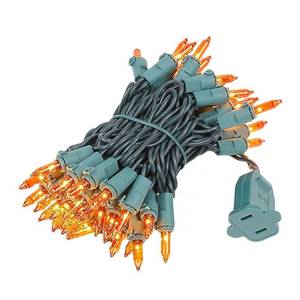 lot 4238 image: Novelty Lights 11 Feet 50 Bulbs Traditional Incandescent Mini Lights, Amber on Green Wire with 2.5 Spacing, Commercial Grade and UL Listed for IndoorOutdoor Use, End-to-End Connectable - Retail $10