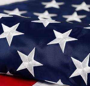 lot 6204 image: American Flag 4x6 ft Long Lasting US Flag, Heavy Duty Nylon, Embroidered Stars, Sewn Stripes, Brass Grommets, UV Protection Perfect for Outdoors USA Flag - Retail $28