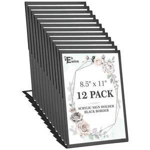 lot 11481 image: EHWINE 12 Pack Acrylic Sign Holder 8.5 x 11, Black Picture Frame Stand up Table Top Sign Holders, Slanted Back Paper Holder Clear Display Stand Menu Flyer Holder for Wedding Party - Retail $37