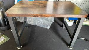 lot 17465 image: Small table with adjustable legs wood top - Retail $45