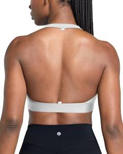 lot 2231 image: QUEENIEKE Halter Neck Sports Bra for Women, Yoga Crop Top with Removable Pads, Open Back V Neck Bra for Gym Workout Light Support (White, X-Small) - Retail $15