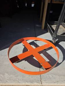 lot 35 image: Orange Industrial Steel Drum Dolly Wheeled  24 inch