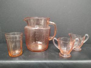 lot 109 image: Vintage Pink Depression Glassware 6 Juice Pitcher, Sugar and Creamer, and Juice Glass