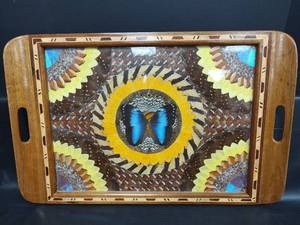 lot 178 image: Vintage Butterfly Wing Art in Detailed Inlaid Wooden Tray Featuring Blue Morpho Butterfly Wings, Arranged with Yellow Sunflowers
