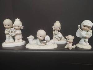 lot 207 image: Vintage Set of Precious Moments Figurines with Original Markings and Enesco Licensing Information