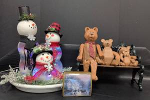 lot 316 image: LED Light-Up Snowman Family Christmas Decoration, Bear Family on Bench and Thomas Kincaid Music Box.
