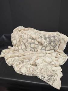 lot 323 image: Crochet Cream Colored Tablecloth 72 x 56