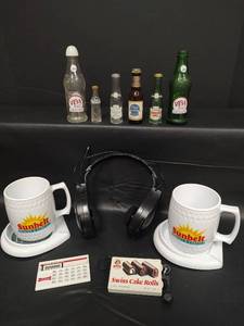 lot 371 image: Vintage Collectibles Assortment - Sunshine AMFM Headset, Swiss Cake Rolls AMFM Radio, Little Debbie Calculator(All Tested), Miniature Bottles and Sunbelt Golf Coaster and Cup