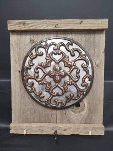 lot 488 image: Decorative Metal Wall Medallion with Floral Design on Rustic Wood 14 x 17